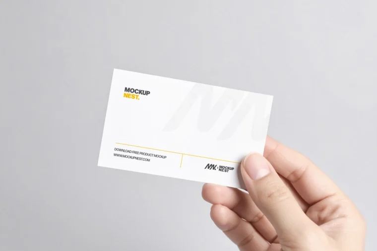 Hand holding business card mockup, PSD format, photorealistic and easy to edit with smart objects.